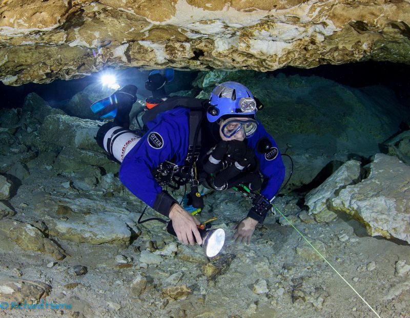 Dr. Richard Harris cave diving, rigging a line in an overhead environment